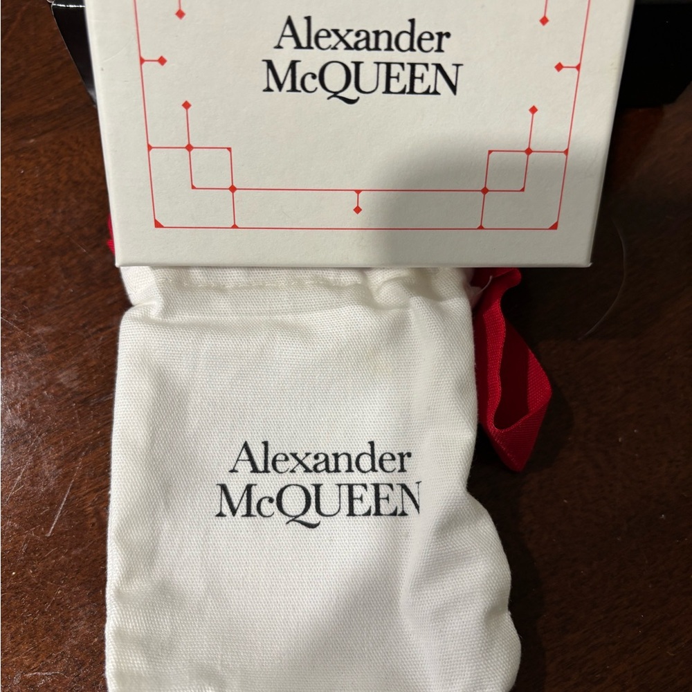 Alexander McQueen thin bracelet, original box & dust bag .  Will fit 6” wrist